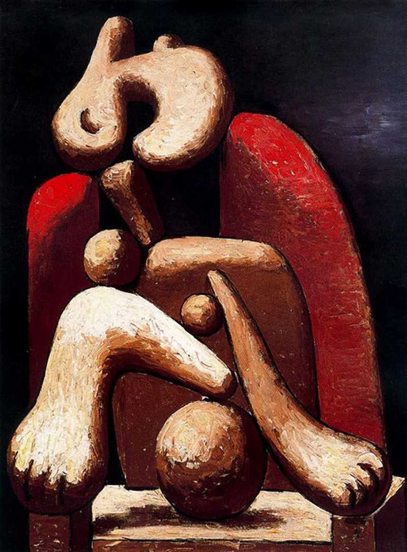 Woman in red armchair