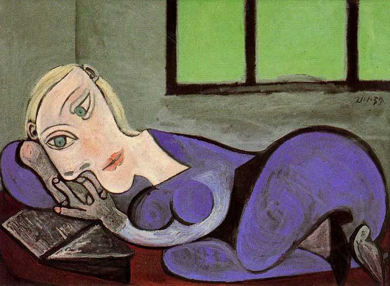 Reclining woman reading