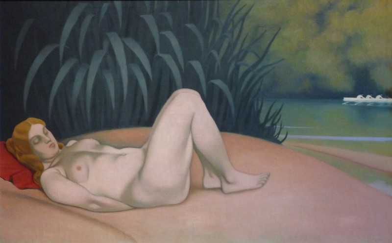 Naked woman sleeping at the edge of the water