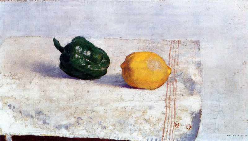 Pepper and Lemon on a White Tablecloth