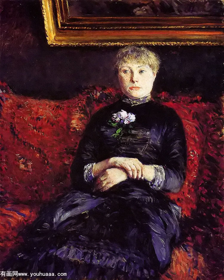 woman sitting on a red flowered sofa