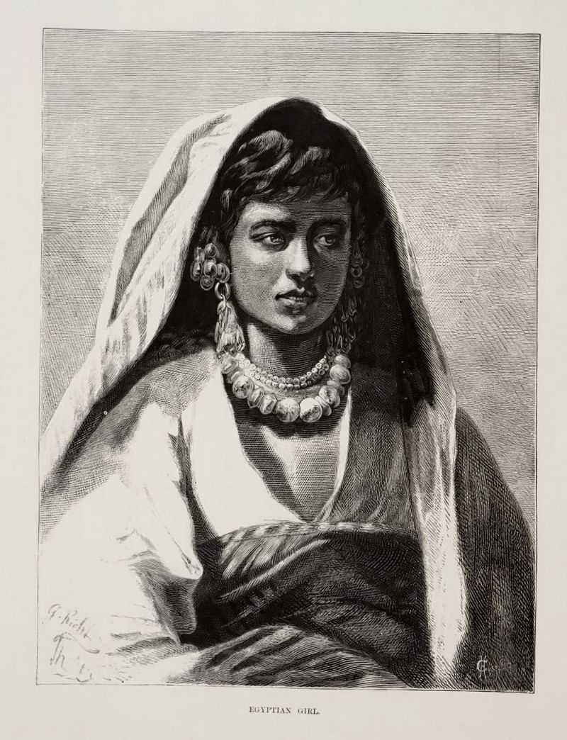 An Egyptian girl wearing a heavy robe, large earrings, and a large necklace