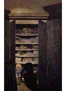 Woman Searching through a Cupboard