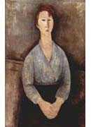 Seated woman weared in blue blouse