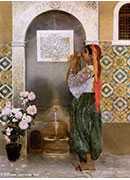 algerian girl beside a fountain