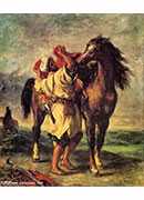 a moroccan saddling a horse