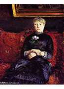 woman sitting on a red flowered sofa