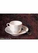 white cup and saucer